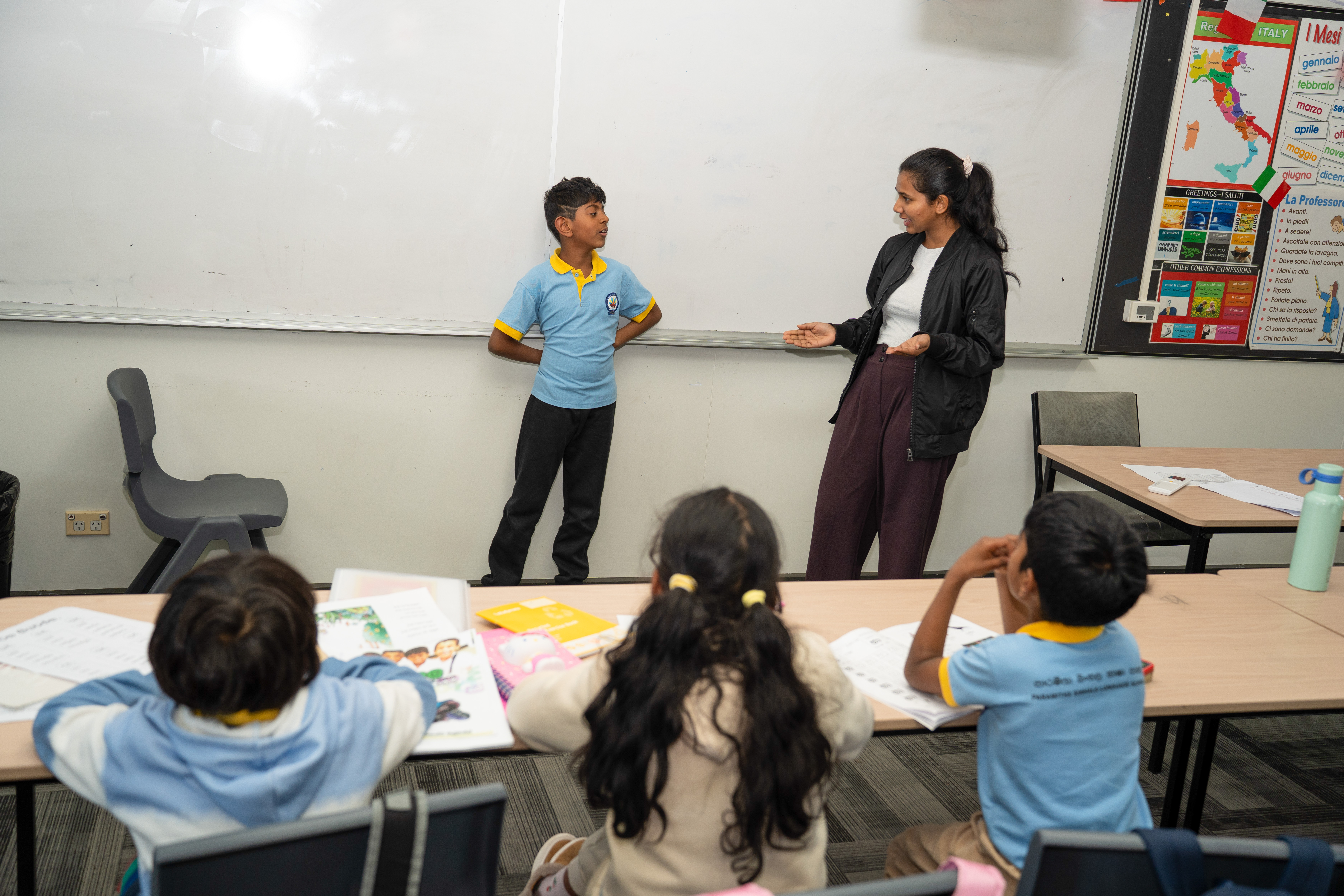 A student focused on her workbook