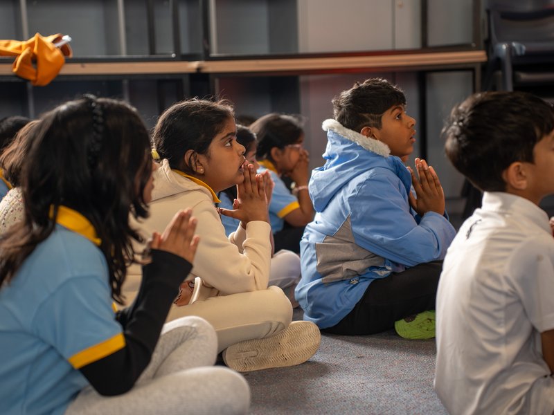Students praying together during the Dharma blessing ceremony