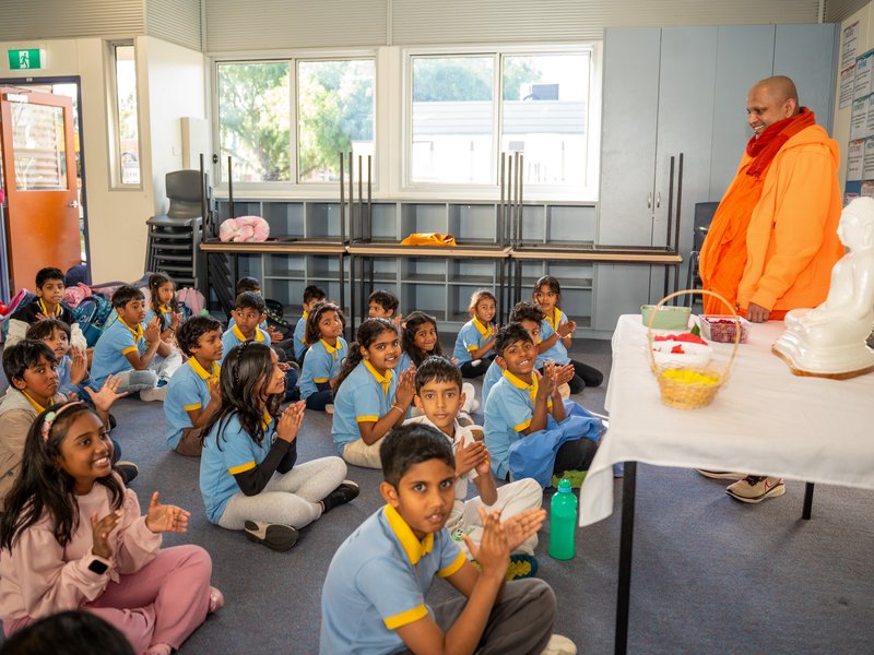 Students seated on the floor listening to a Dharma talk